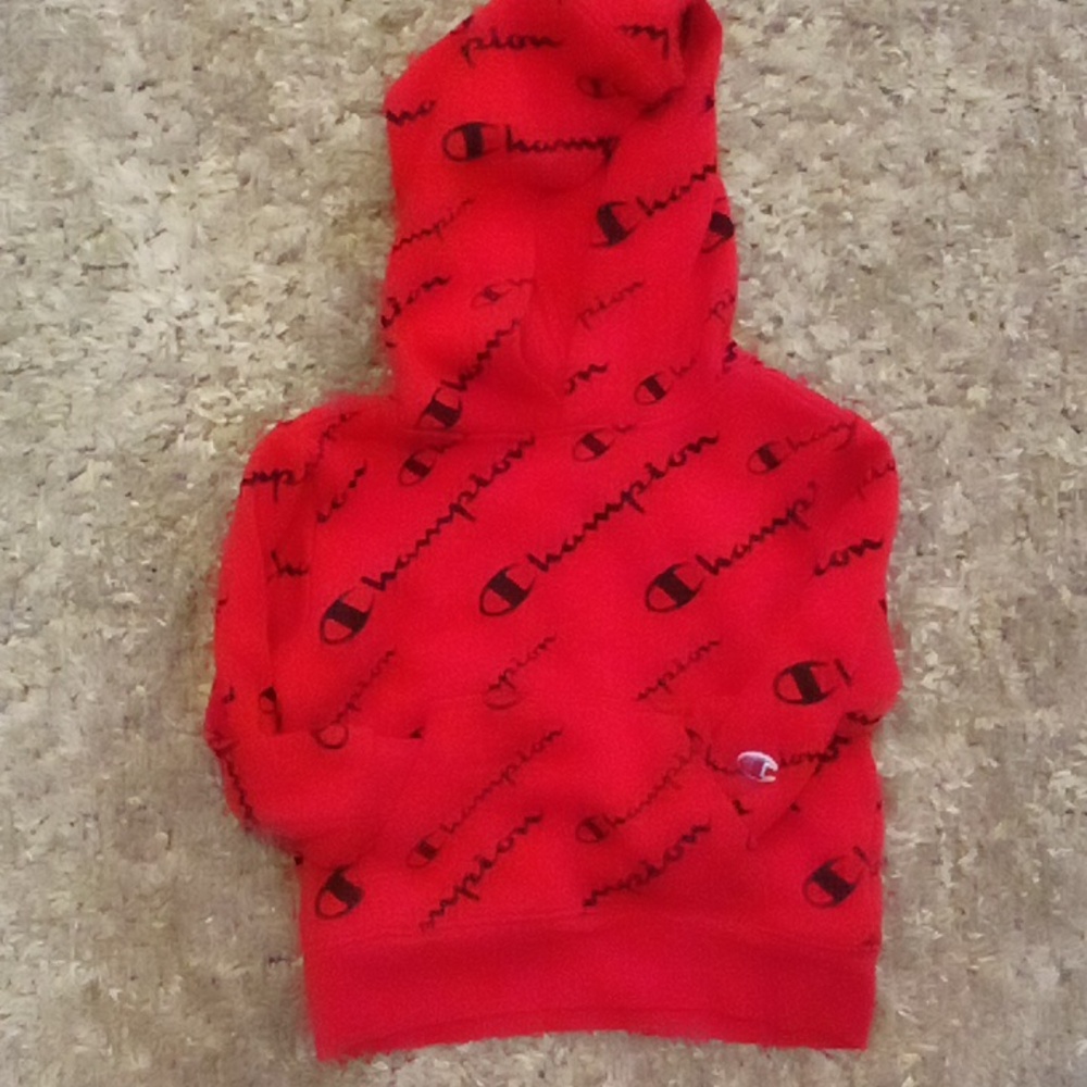 Red and Black pull over. Champions